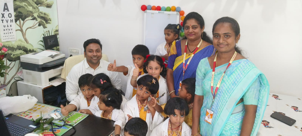 Dr. Shankar with children at Shemford Primary School visit